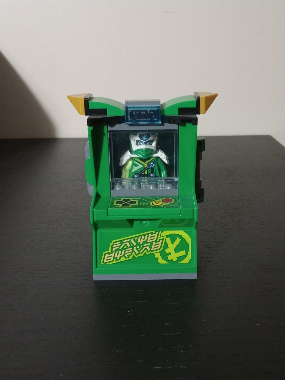 The item in your image is the LEGO Ninjago: Lloyd Avatar Arcade Pod (Set 71716)